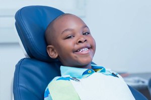 Smiling young boy in dental chair