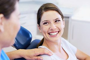 Smiling woman in dentistry chair