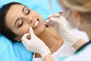 woman having dental cleaning