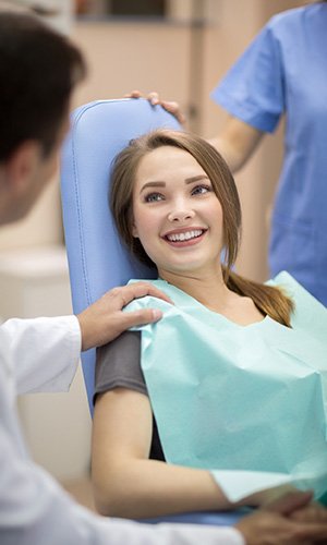 Smiling woman in dental exam chair