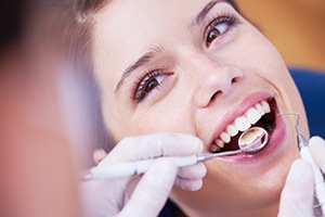 Woman receiving dental cleaning