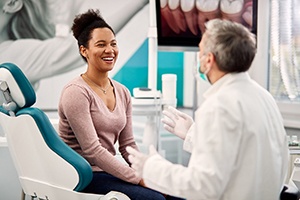 woman talking to cosmetic dentist in Pittsburgh