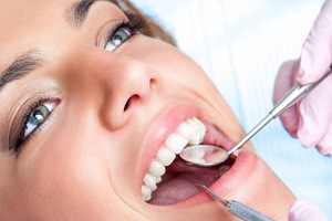 Closeup of female patient during dental exam