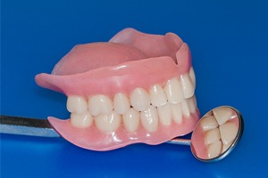 Denture and dental mirror