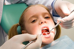 Child receiving dental exam