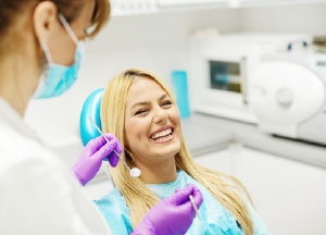 Laughing woman in dental chair