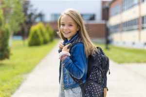 Child smiling on first day of school