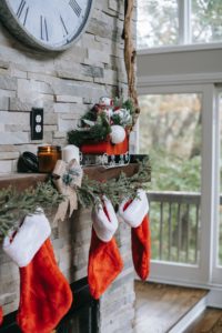 Stocking stuffers hanging on a mantel. 